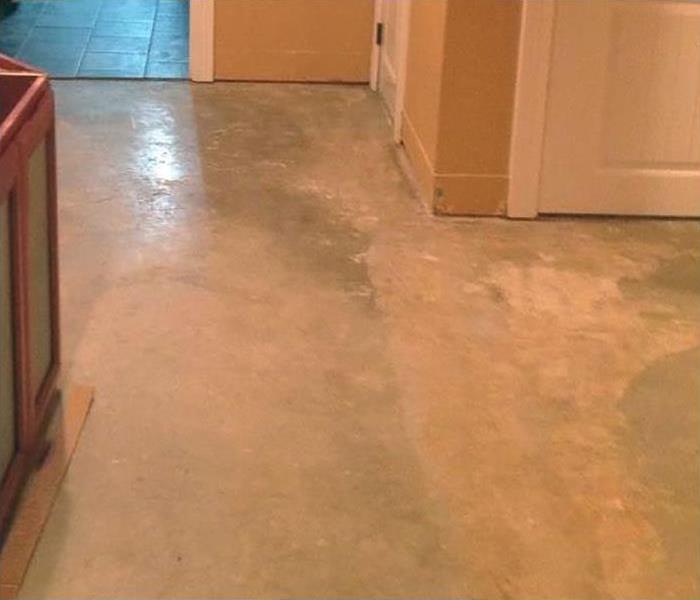 concrete floor in a home with water damage
